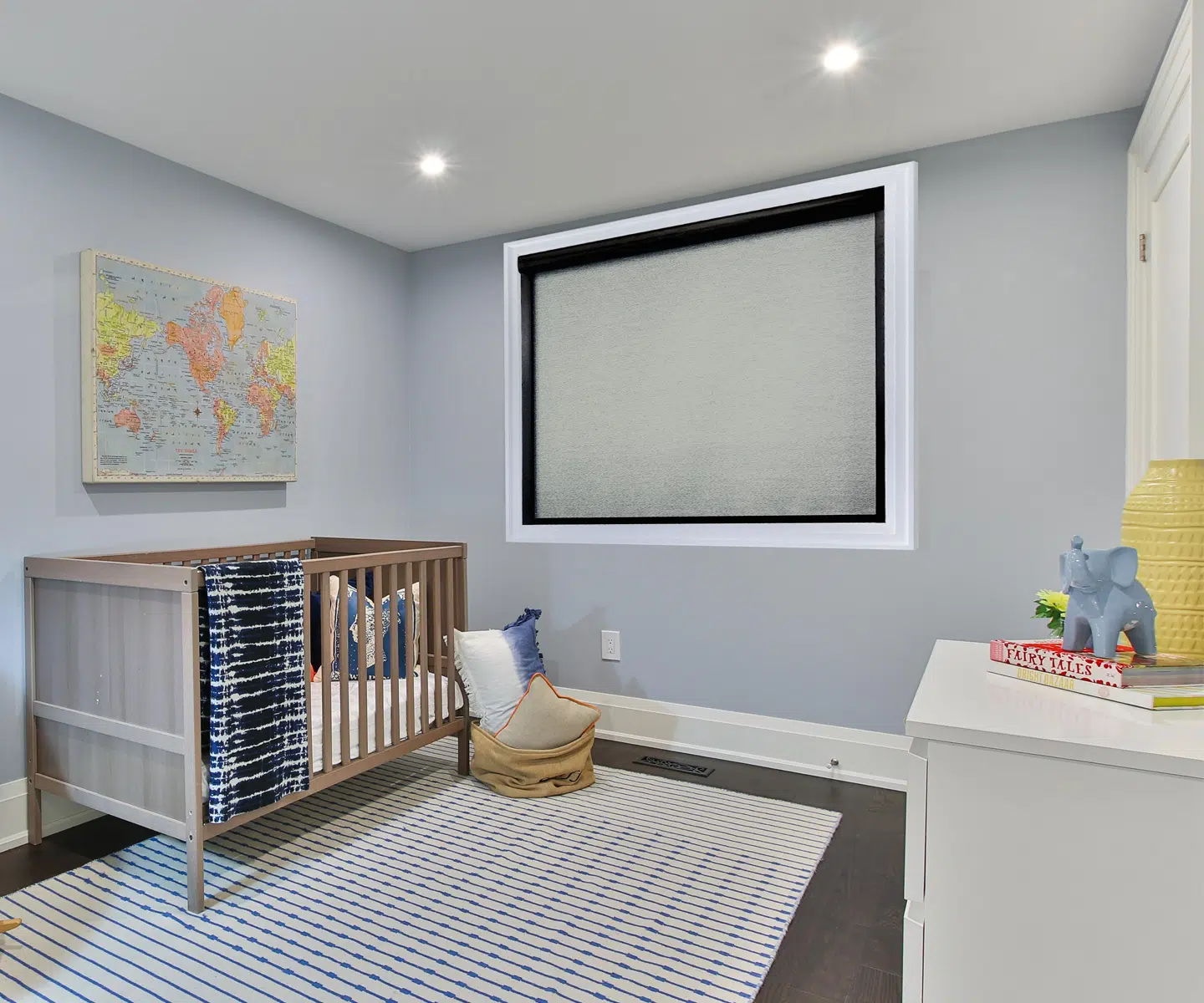 Norman Soluna ROller Shades in a room with crib.jpg